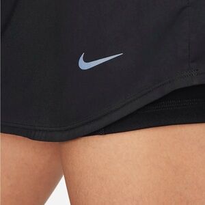 Nike,  brand new with tag. SKORTS. Activewear skirt with shorts underneath!